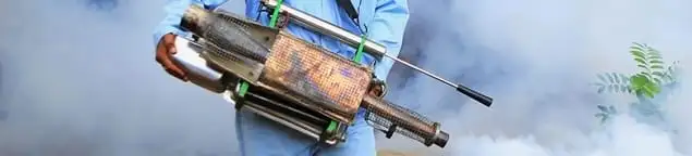 Fumigation technician using a fogger for deep pest treatment in Sacramento, CA